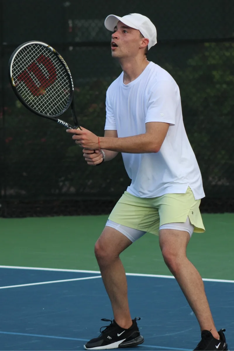 Adult beginner learning to swing during a Tennis 101 tennis lesson in Indianapolis